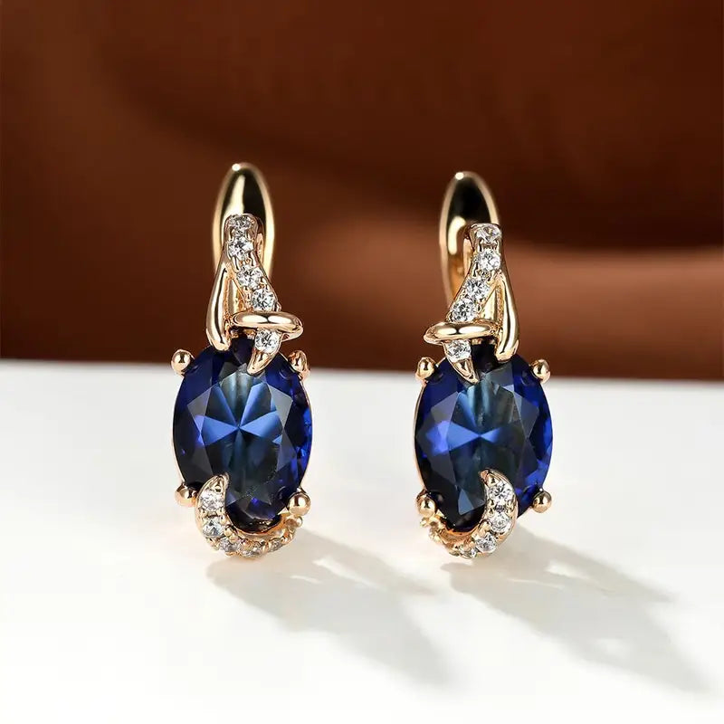 Elegant gold earrings with a refined hanging link