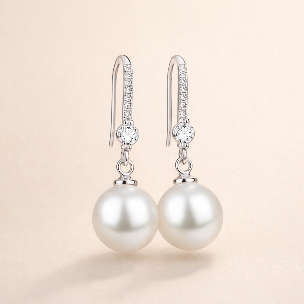Elegant white gold pearl earrings with cubic zirconia