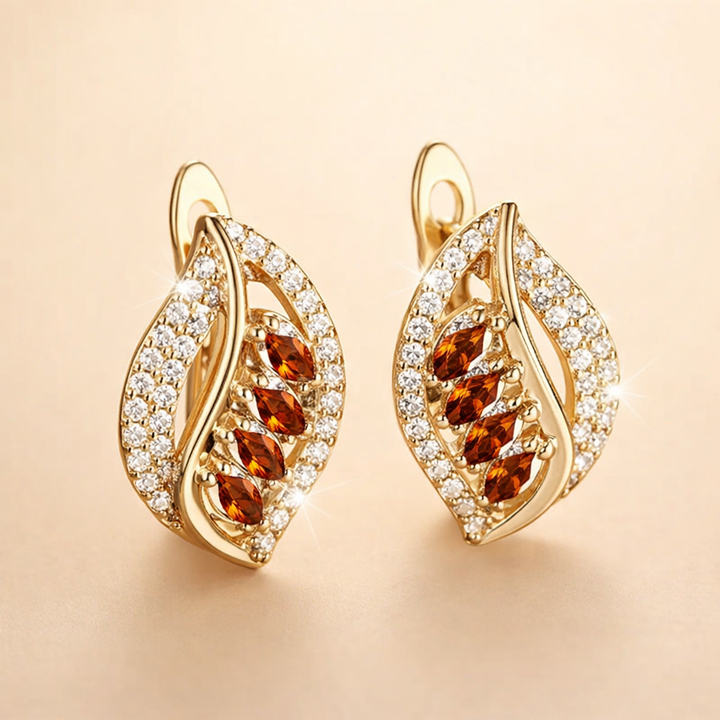 Soft gold earrings with a rosé shine