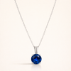 Elegant white gold necklace with round-cut sapphire