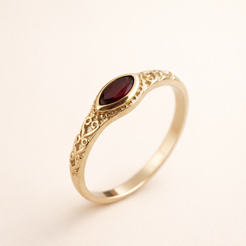 Elegant gold ring with a red cubic zirconia