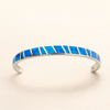 Silver bracelet with blue opal and refined details