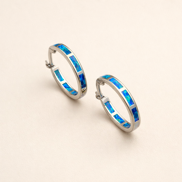 Elegant silver earrings with opal in ocean style