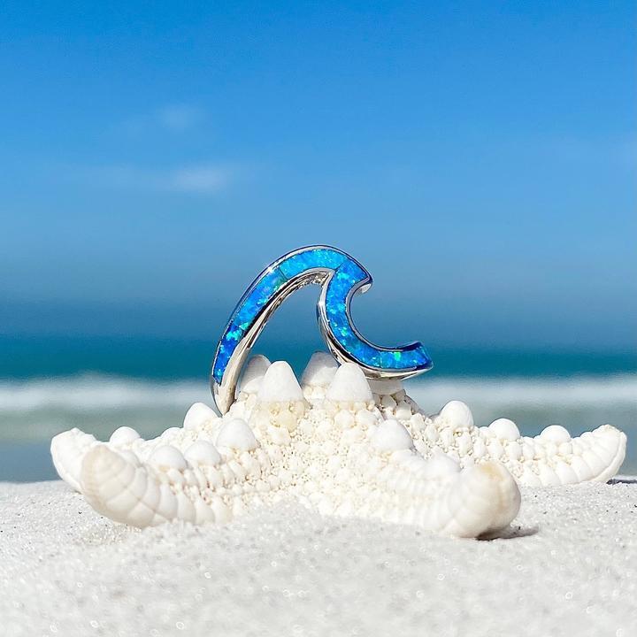 Silver ring with opal and wavy shapes