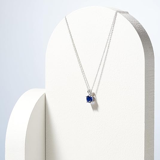 Elegant white gold necklace with round-cut sapphire