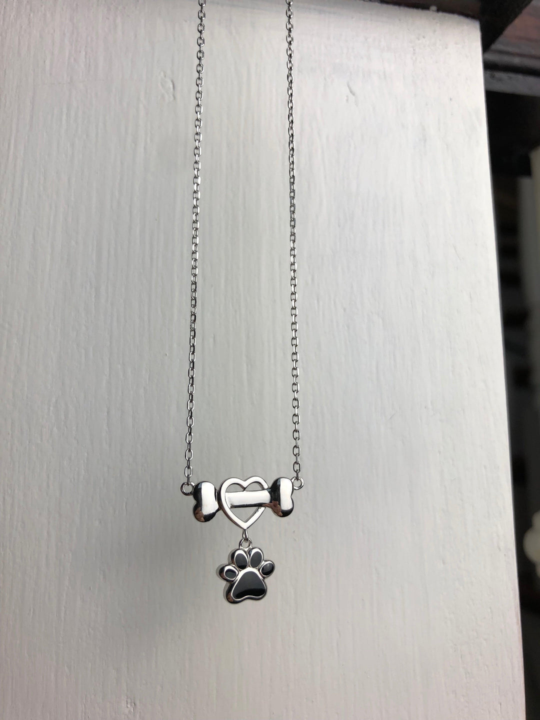Delicate Dog Paw Pendant in Stainless Steel