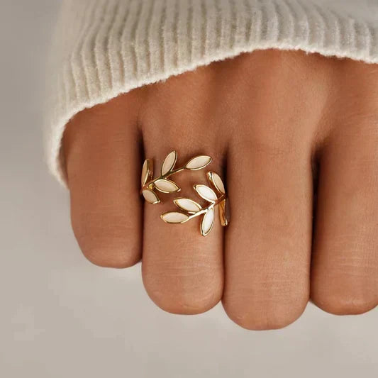 Simple silver ring with white opal leaf motif