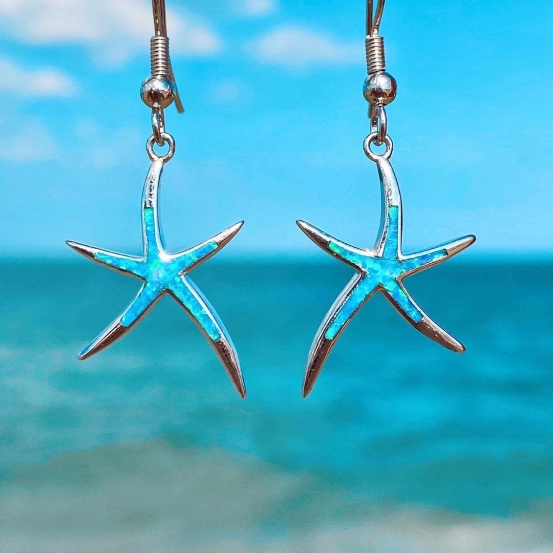 Silver earrings with opal and starfish design