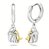 Minimalist silver earrings with little dog