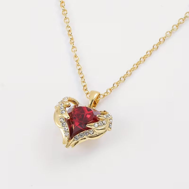 Soft Embrace gold necklace with ruby heart