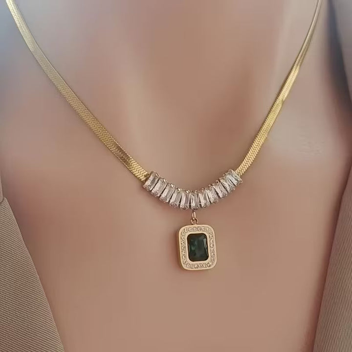 Elegant Gold Pendant with Emerald Prism