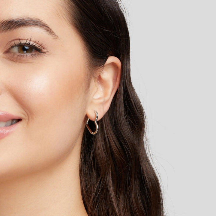 Elegant silver earrings with heart-shaped details