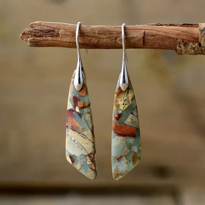 Elegant gold earrings with antique natural stone