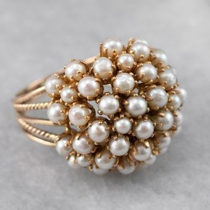 Ring with inlaid pearl accent