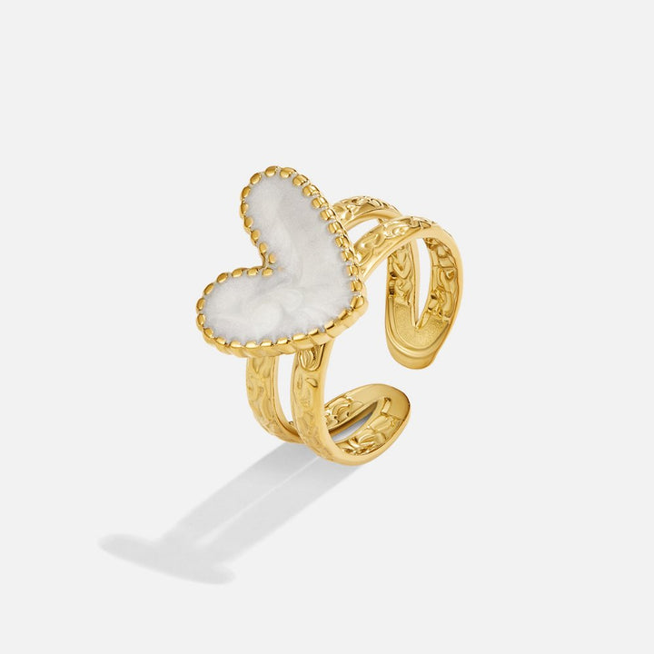 Simple gold ring with little heart