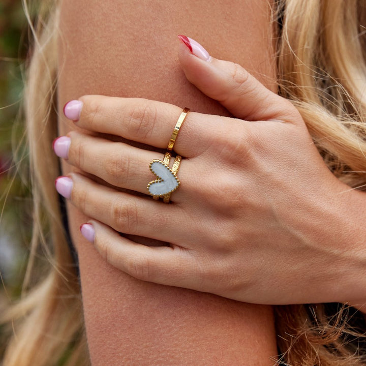 Simple gold ring with little heart