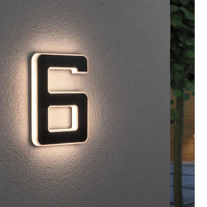 Solar-lit house number with LED and dusk sensor